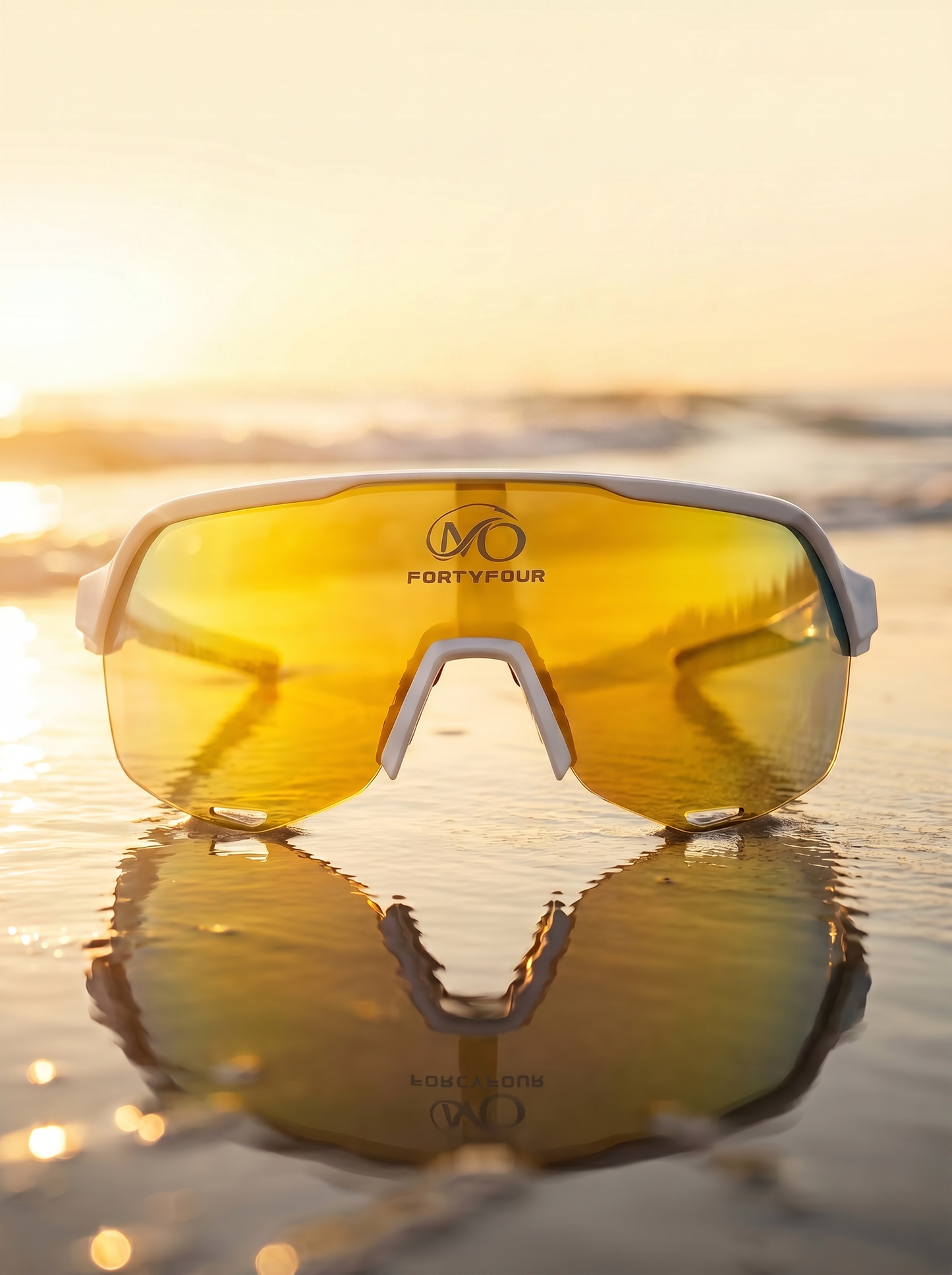 FortyFour Aura Sunglasses with gold mirror lens at sunset