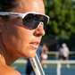 Pickleball player wearing FortyFour Aura Sunglasses courtside