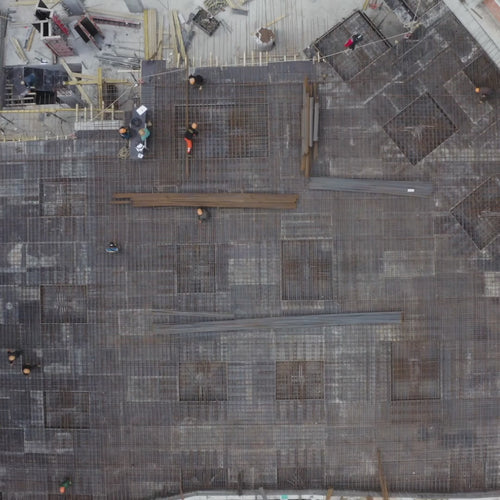 Aerial view of a professional pickleball court at a Caribbean resort property surrounded by tropical landscaping and ocean views